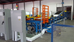 Nordion, tote or carrier machine, electric winch-style drive mechanism