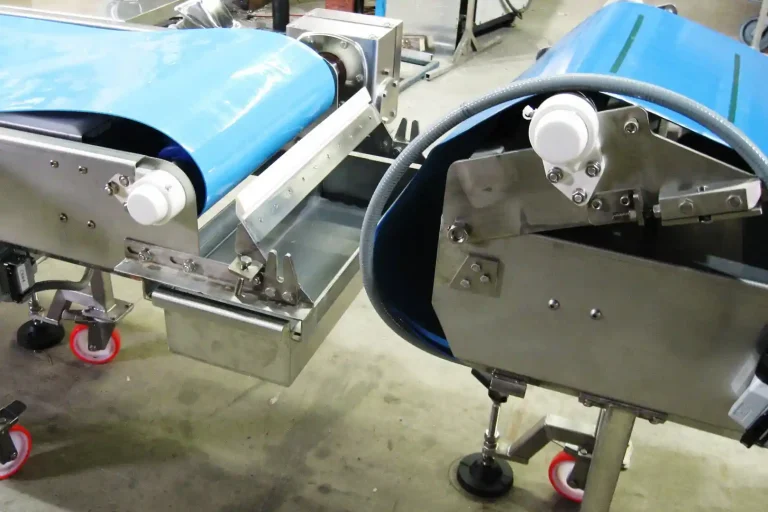Flip-up conveyor end for easy sanitation and cleaning