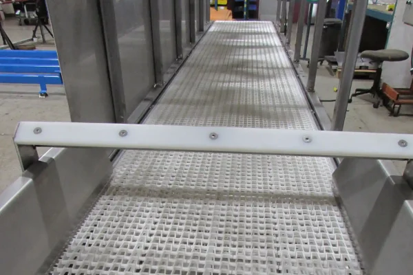 Open modular belt cooling conveyor in food production line