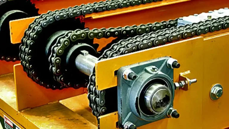 Multi-strand chain conveyor system transporting heavy steel coils and large industrial fixtures