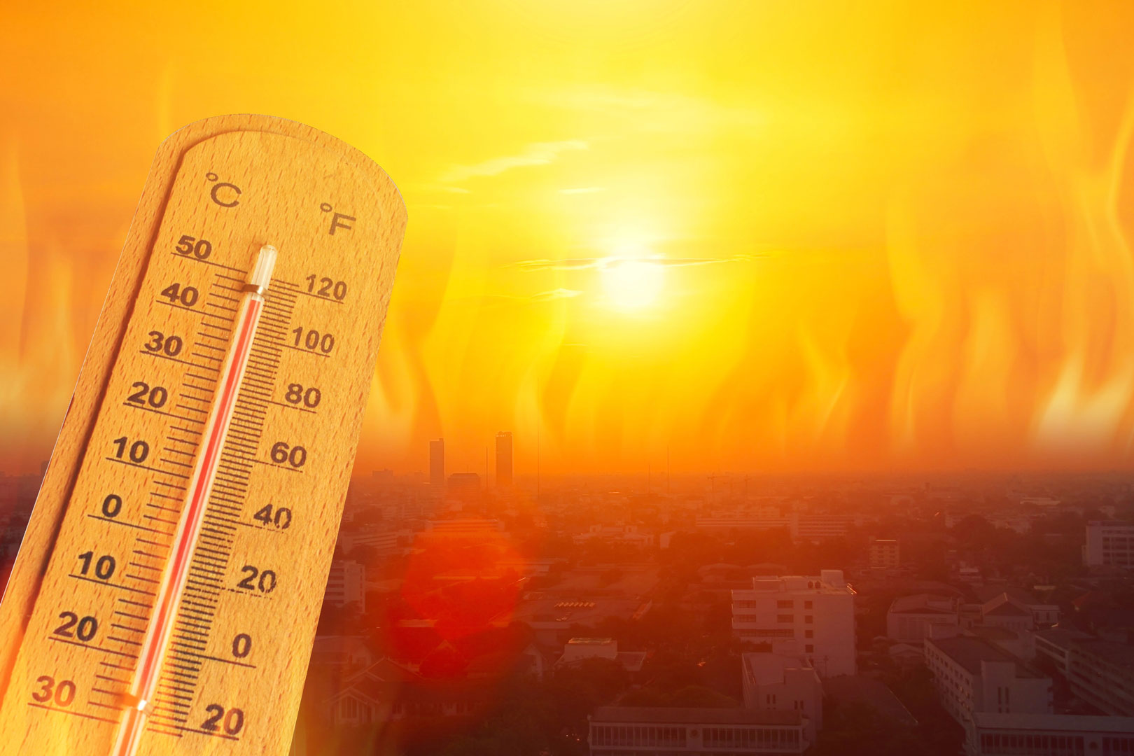 Extreme temperatures thermometre over a city